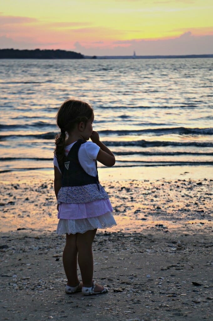 Baby girl in sunset