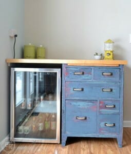 custom-counter-with-beverage-fridge-and-antique-cabinet