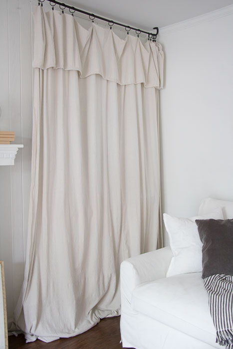 how to hide a TV with a drop cloth curtain