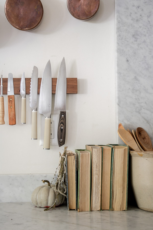 Create warmth in a white kitchen using cutting boards - Duke Manor Farm by  Laura Janning